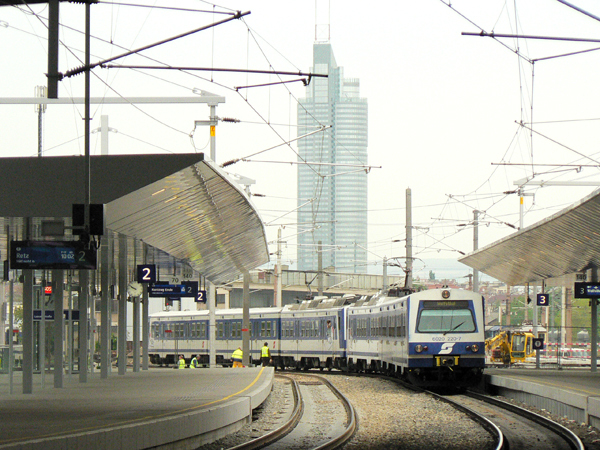 The city railway arrives in the station Praterstern, in the background is the Millennium Tower