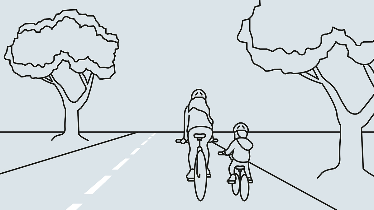 Eine erwachsene Person und ein Kind nebeneinander am Rad auf der Straße