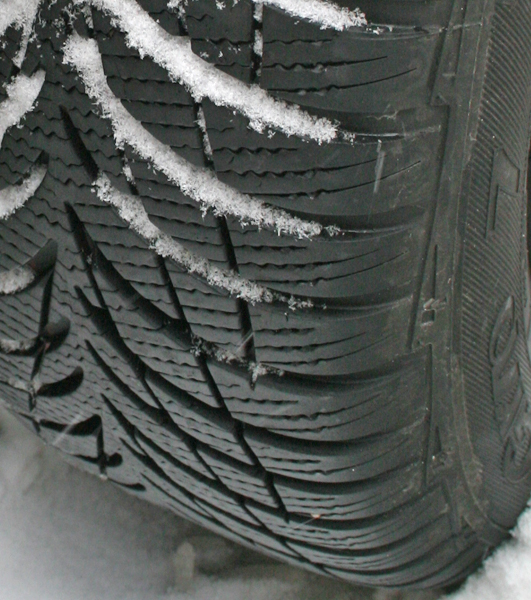 a car tyre in the snow